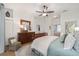 Main bedroom with a king-size bed, dresser, and ceiling fan at 2330 Nw 59Th Ave, Ocala, FL 34482