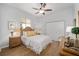 Comfortable bedroom with a ceiling fan, wood floors, and built-in closet at 2330 Nw 59Th Ave, Ocala, FL 34482