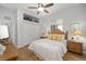 Bright bedroom with ceiling fan, wood floors, and large closet at 2330 Nw 59Th Ave, Ocala, FL 34482