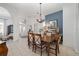 Elegant dining room with a wooden table and chairs near the entryway at 2330 Nw 59Th Ave, Ocala, FL 34482