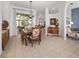 Spacious dining room with a wooden table, six chairs, and views into other rooms at 2330 Nw 59Th Ave, Ocala, FL 34482