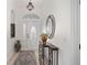 Elegant entryway with decorative mirror and console table at 2330 Nw 59Th Ave, Ocala, FL 34482