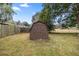 Brown wooden shed in backyard with grassy area at 2540 Se 35Th St, Ocala, FL 34471