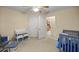 Charming bedroom with a crib and changing table at 2540 Se 35Th St, Ocala, FL 34471