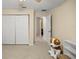 Simple bedroom with double doors leading to the hallway at 2540 Se 35Th St, Ocala, FL 34471