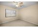 Small bedroom with a window and ceiling fan at 2540 Se 35Th St, Ocala, FL 34471