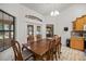 Dining area with a wood table and chairs, and access to the backyard at 2540 Se 35Th St, Ocala, FL 34471