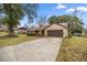 Exterior view of house with driveway and landscaping at 2540 Se 35Th St, Ocala, FL 34471