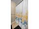 Shower with a floral shower curtain and tiled walls at 2540 Se 35Th St, Ocala, FL 34471