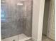 Bathroom with a large walk-in shower and gray tile at 3 Olive Way, Ocala, FL 34472