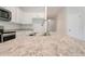 Kitchen island with stainless steel sink and granite countertops at 3192 Ne 46Th Ave, Ocala, FL 34470