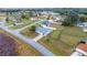 Aerial view showcasing the home, its lot, surrounding neighborhood, and nearby roads at 331 Oak Lane Dr, Ocala, FL 34472