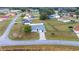 Aerial view of home with a long driveway, fenced yard, and mature trees at 331 Oak Lane Dr, Ocala, FL 34472