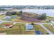 Scenic aerial view showcases a home with views of a lake and surrounding greenery, providing a serene setting at 331 Oak Lane Dr, Ocala, FL 34472