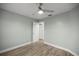Light-filled bedroom featuring wood-style flooring and a ceiling fan at 331 Oak Lane Dr, Ocala, FL 34472