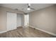 Bedroom with a ceiling fan, closet and wood look tile flooring at 331 Oak Lane Dr, Ocala, FL 34472