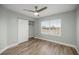 Bedroom featuring wood look tile flooring, a closet, and a window at 331 Oak Lane Dr, Ocala, FL 34472