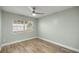 Empty bedroom featuring wood-style flooring and a bright window at 331 Oak Lane Dr, Ocala, FL 34472