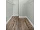 Walk-in closet with wood-look tile floor and ample shelving for optimal organization at 331 Oak Lane Dr, Ocala, FL 34472