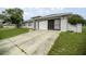 Charming single-Gathering home featuring a two-car garage, screened enclosure and a well-manicured lawn at 331 Oak Lane Dr, Ocala, FL 34472