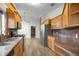 Spacious kitchen featuring sleek stainless steel appliances, granite counters, and wood cabinets at 331 Oak Lane Dr, Ocala, FL 34472