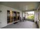 Inviting screened patio with comfortable seating, ideal for relaxation and enjoying the outdoors at 331 Oak Lane Dr, Ocala, FL 34472