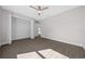 Spacious bedroom with wood-look floors, large closet and window at 3444 Se 139 Ln, Summerfield, FL 34491