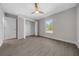 Well-lit bedroom with wood-look floors, large closet, and window at 3444 Se 139 Ln, Summerfield, FL 34491