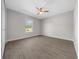 Bright bedroom with wood-look floors, large closet, and window at 3444 Se 139 Ln, Summerfield, FL 34491