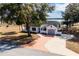 Lakefront home with large yard and circular driveway at 4 Hickory Track Trce, Ocala, FL 34472