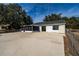 Large concrete patio and fenced backyard at 4 Hickory Track Trce, Ocala, FL 34472