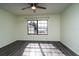 Bedroom with gray laminate flooring and a large window with a lake view at 4 Hickory Track Trce, Ocala, FL 34472