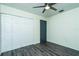 Bedroom with gray laminate flooring and double closets at 4 Hickory Track Trce, Ocala, FL 34472