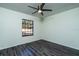 Bedroom with gray laminate flooring and a ceiling fan at 4 Hickory Track Trce, Ocala, FL 34472