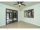 Bedroom with access to screened porch and backyard views at 4 Hickory Track Trce, Ocala, FL 34472