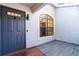 Inviting entryway with gray door and modern tile flooring at 4 Hickory Track Trce, Ocala, FL 34472