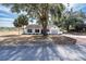 Newly renovated home with gray garage door and white exterior at 4 Hickory Track Trce, Ocala, FL 34472