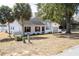 Newly renovated home with gray garage door and white exterior at 4 Hickory Track Trce, Ocala, FL 34472