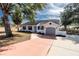 Newly renovated home with gray garage door and white exterior at 4 Hickory Track Trce, Ocala, FL 34472