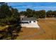 Aerial view of house back, patio, and yard at 4 Hickory Track Trce, Ocala, FL 34472