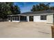 House exterior with screened porch and patio at 4 Hickory Track Trce, Ocala, FL 34472