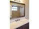 Bathroom with tile flooring, modern vanity, bronze fixtures, and a large framed mirror at 404 Cr 487, Lake Panasoffkee, FL 33538