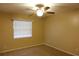 Bedroom with ceiling fan, window with blinds, and carpeted floor at 404 Cr 487, Lake Panasoffkee, FL 33538