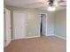 Spacious bedroom with double door closet and neutral decor at 404 Cr 487, Lake Panasoffkee, FL 33538