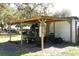 Covered outbuilding used to house an airboat and other outdoor equipment, offering outdoor storage space at 404 Cr 487, Lake Panasoffkee, FL 33538