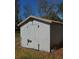 Exterior view of the shed, providing extra storage space for tools and equipment, enhancing the property's functionality at 404 Cr 487, Lake Panasoffkee, FL 33538