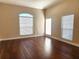 Bright bedroom with hardwood floors and large windows at 4117 Sw 30Th Ct, Ocala, FL 34474