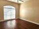 Bright bedroom with hardwood floors and a large window at 4117 Sw 30Th Ct, Ocala, FL 34474