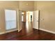 Hardwood floor bedroom with access to the living room at 4117 Sw 30Th Ct, Ocala, FL 34474