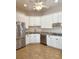 Kitchen boasts granite countertops and stainless steel appliances at 4117 Sw 30Th Ct, Ocala, FL 34474